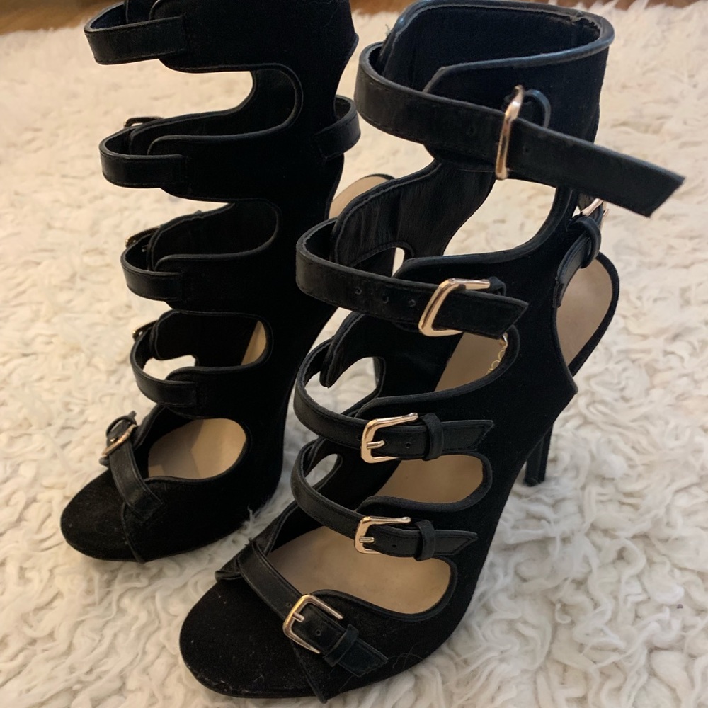 Black heels with gold buckles